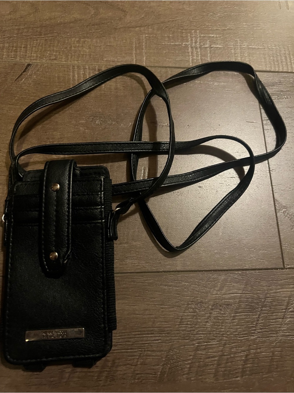 black Kenneth Cole Reaction phone crossbody bag